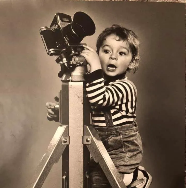 Young Mike Mala age 3 with grandfather Zbigniew Kryda large format camera on tripod, Poland — photography runs in the family